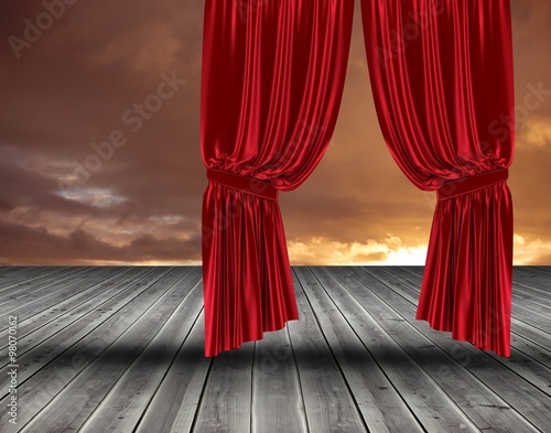 Red curtain pulling back