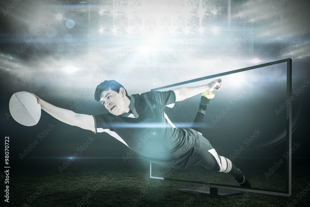 Fototapeta premium Composite image of a rugby player scoring a try