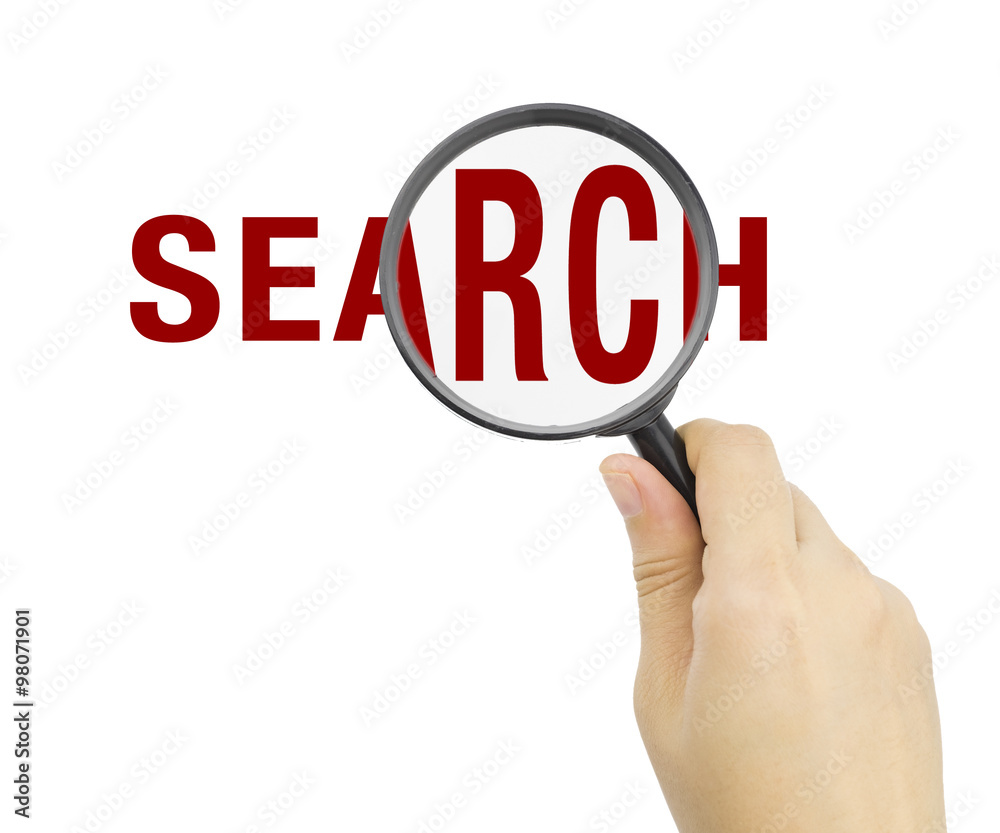 Hand showing SEARCH word through magnifying glass Hand showing SEARCH word through magnifying glass