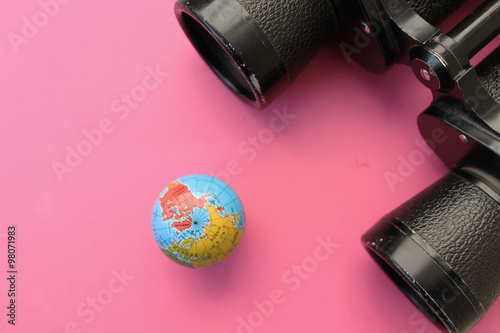 Binoculars and globe