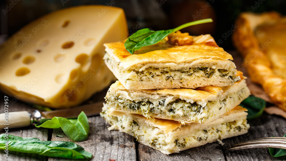 Homemade pie stuffed with cheese and spinach Homemade pie stuffed with cheese and spinach