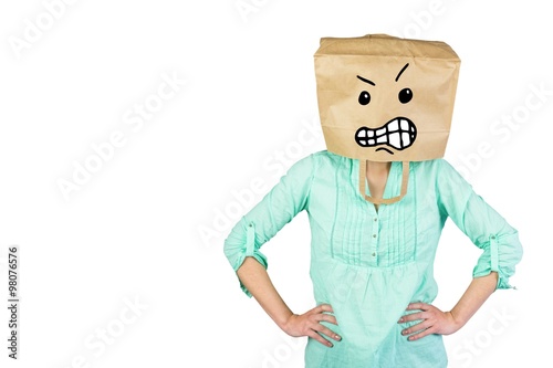 Composite image of woman covering head with brown paper bag 