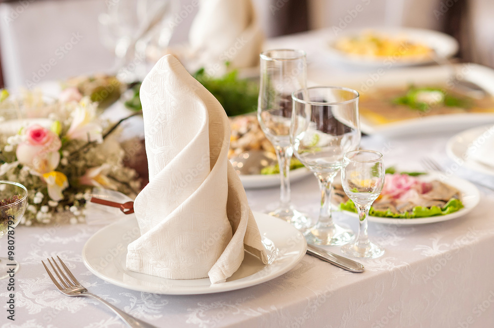 Table setting at a luxury wedding or another catered event Table setting at a luxury wedding or another catered event