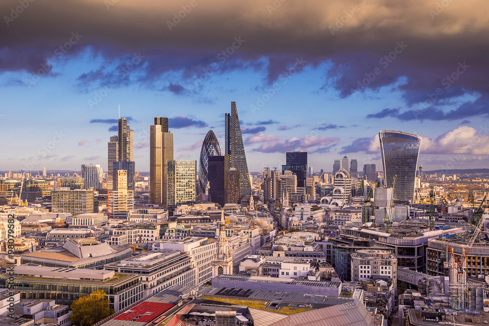 Dark clouds over London's business district at sunset - Panoramic skyline of London - UK