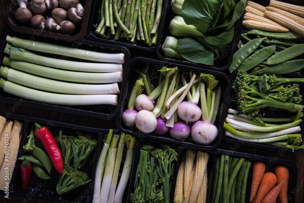 Fresh vegetables in plastic trays