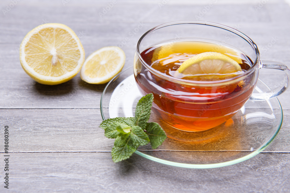 reshly brewed tea in glass cup wooden background reshly brewed tea in glass cup wooden background