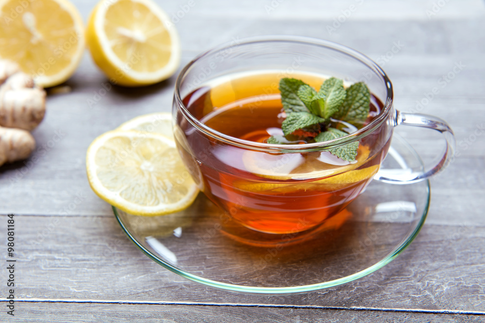 reshly brewed tea in glass cup wooden background reshly brewed tea in glass cup wooden background