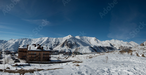 Top of ski slope at nice sun morning. Caucasus Mountains, Georgia, region Gudauri.