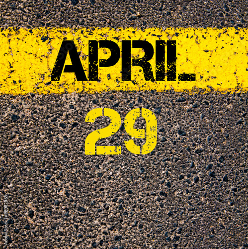 29 April calendar day over road marking yellow paint line