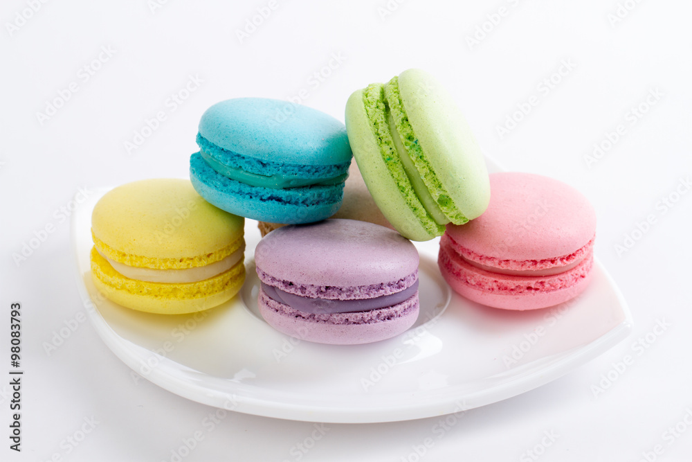 Obraz premium Collection of brightly colored French macarons on white backgrou