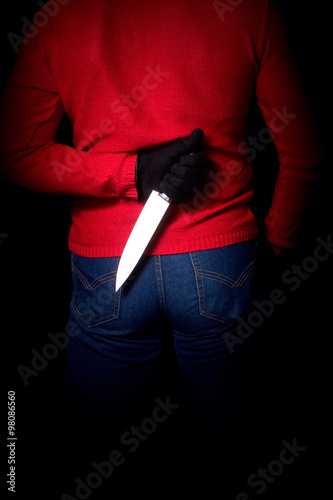 Man With Knife behind Back