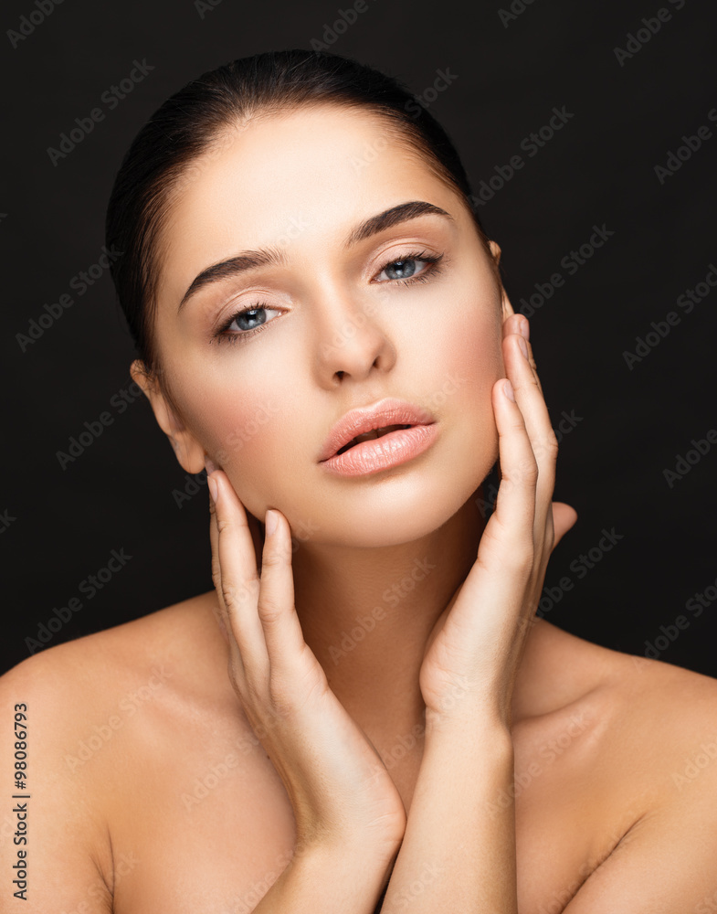 Young woman touching her face. Beauty girl Young woman touching her face. Beauty girl