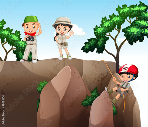 Girl and boys climbing up the mountain