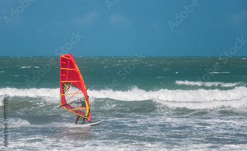 Jericoacoara, Ceara, Brazil - December 10, 2015 : Unidentified windsurfer riding on the waves in Atlantic ocean, documentary editorial.