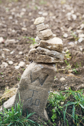 boundary stone at a brown field