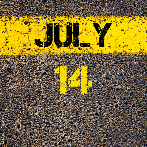 14 July calendar day over road marking yellow paint line photo