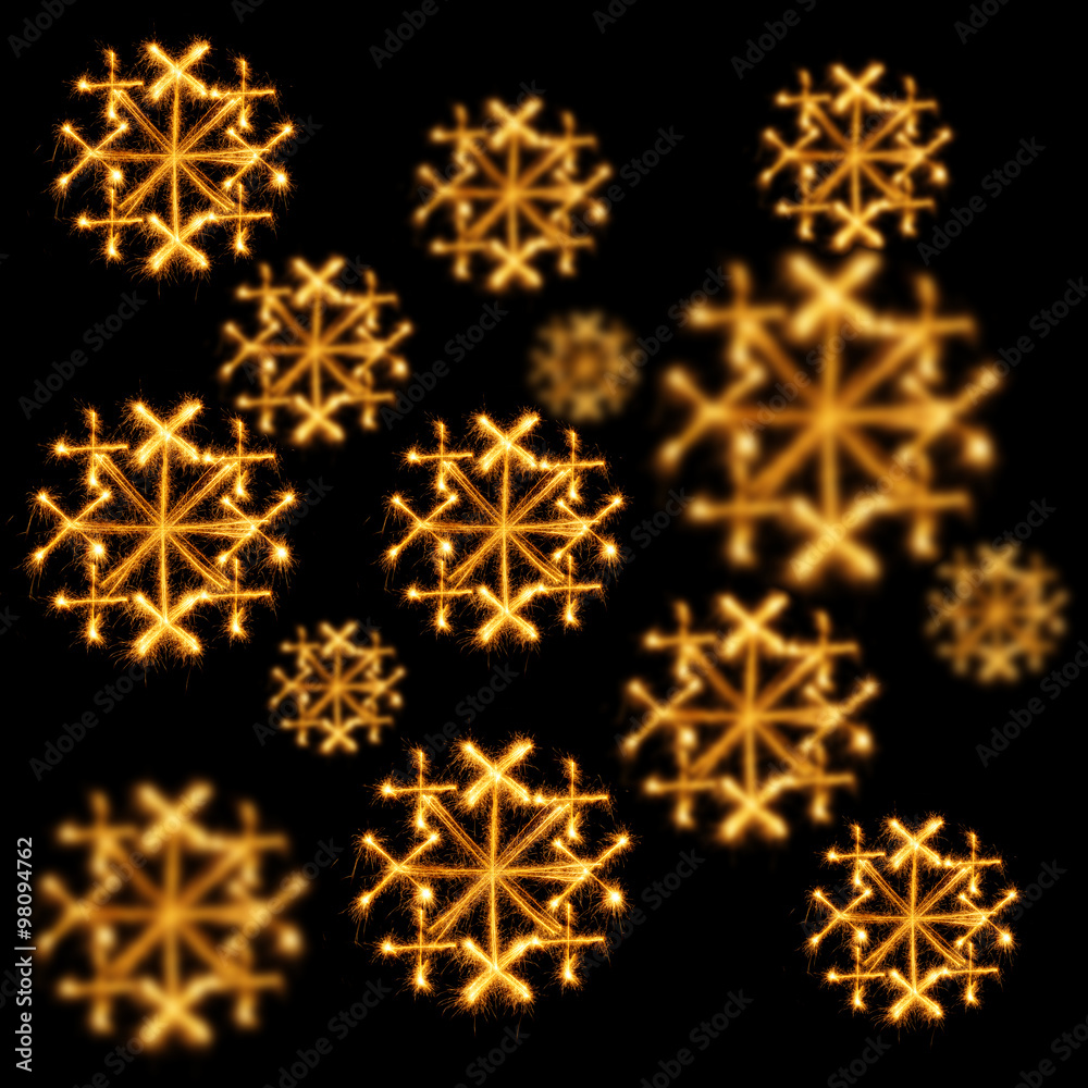 Background of snowflakes made with sparklers on black Background of snowflakes made with sparklers on black