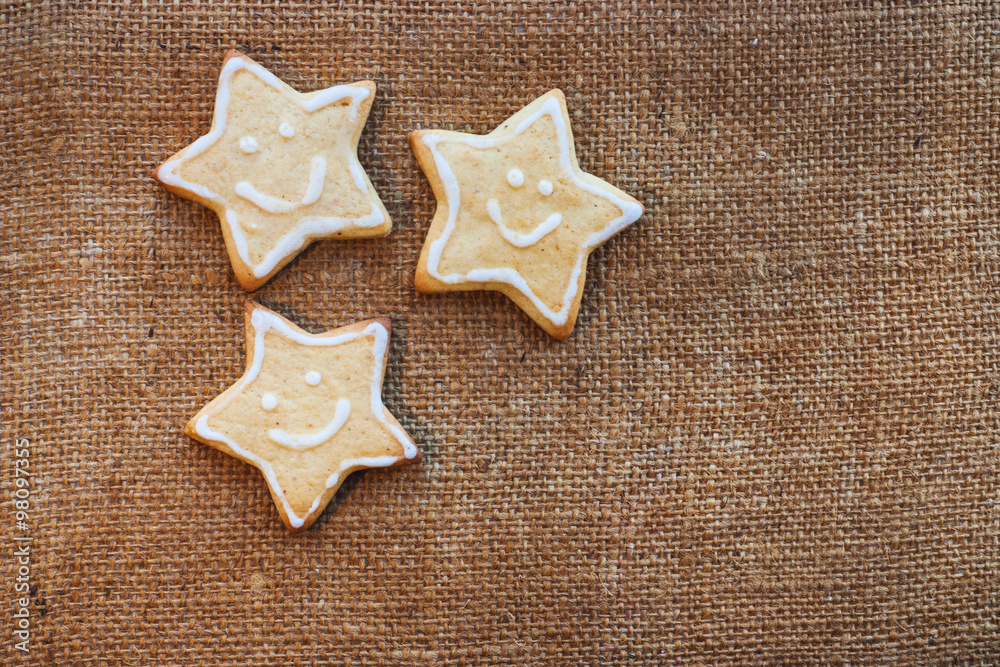 Three christmas cookies on the flax texture Three christmas cookies on the flax texture