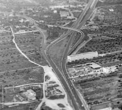 Black and white aerial view of the road. Tilt-shift effect.