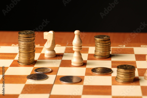 Coins on a chessboard. Finance concept. money concept