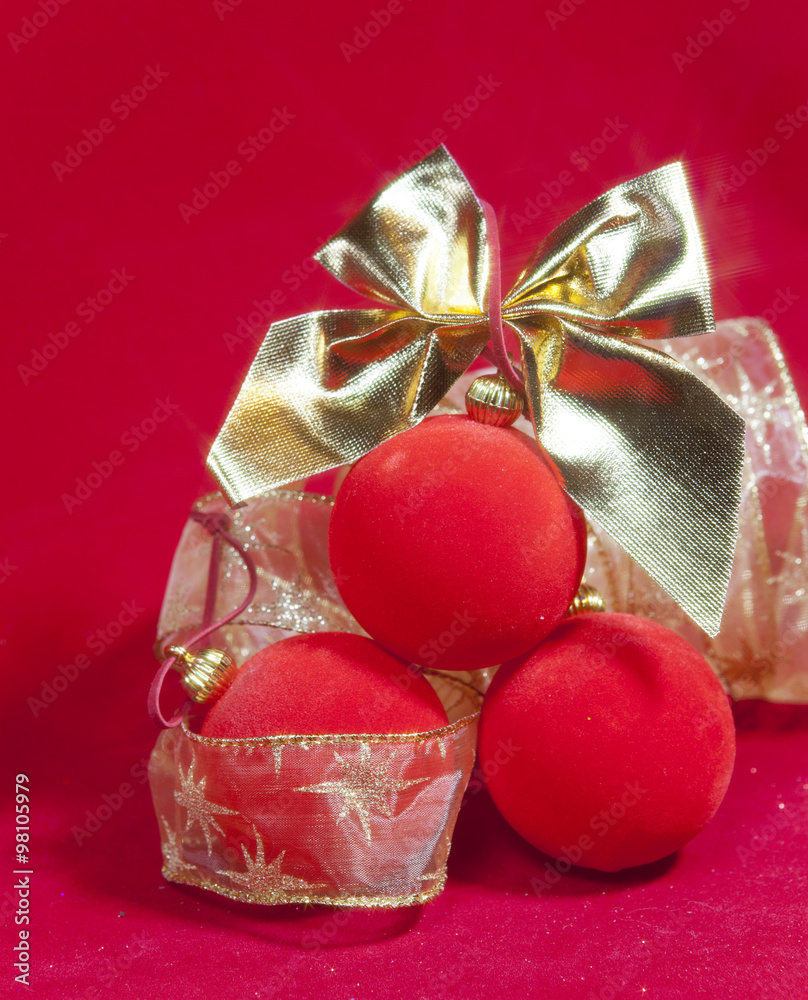 New Year's composition on a red background - ball and ribbon New Year's composition on a red background - ball and ribbon