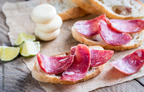 Ciabatta sandwiches with fuet and mini cheese photo