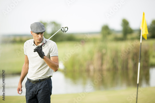 Young man playing golf
