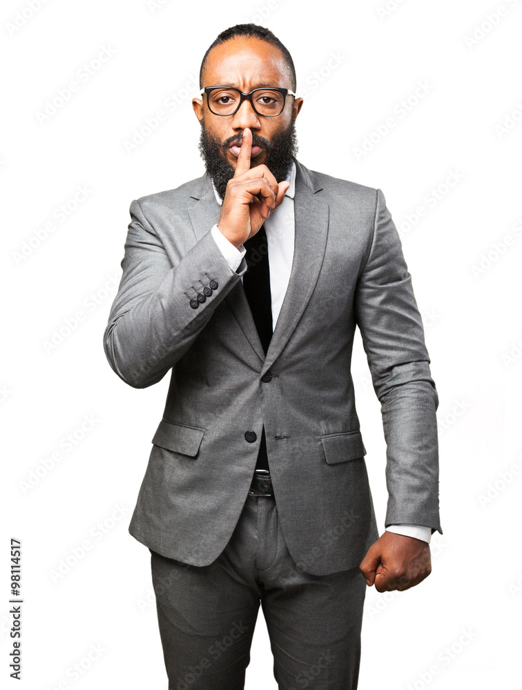business black man doing a silence gesture business black man doing a silence gesture