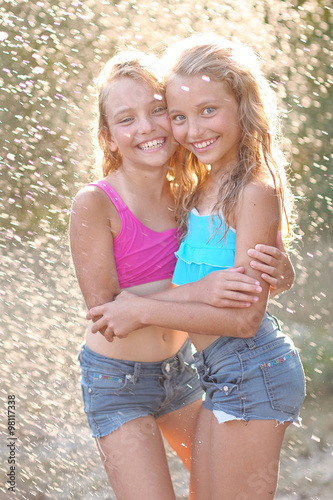 portrait of two girls of girlfriends on a summer nature