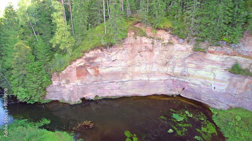 The sandstone in the mountain and the Ajha river found in Taevaskoda Estonia with lots of trees on the forest  photo