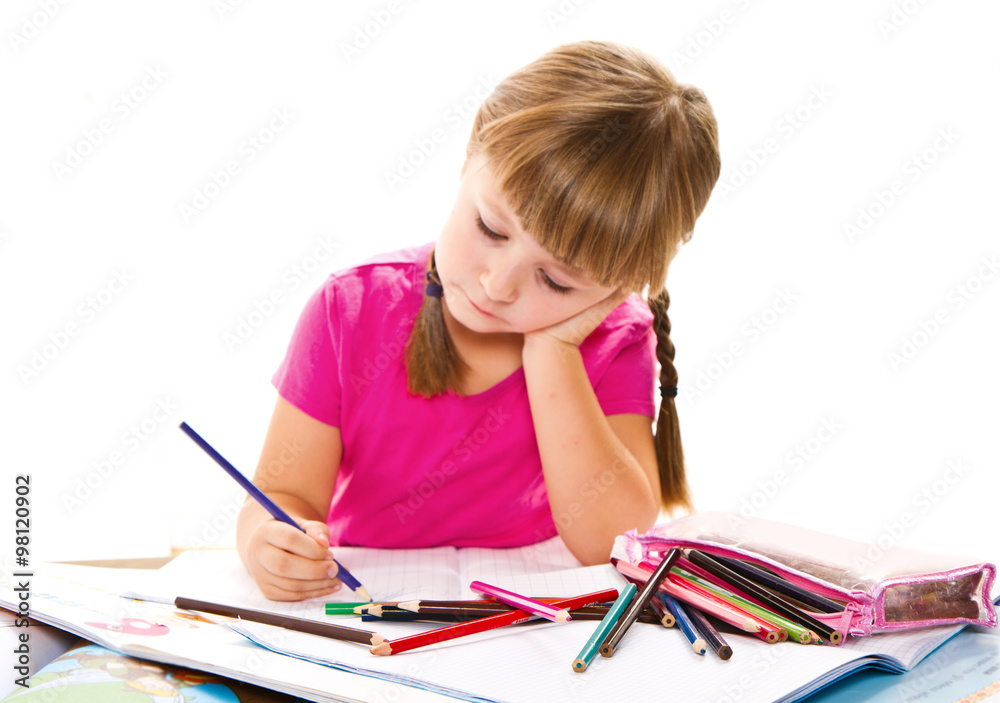 lovely little girl writing at the desk lovely little girl writing at the desk