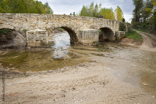 Roman bridge over Arandilla river in Coruña del Conde, Burgos, Spain