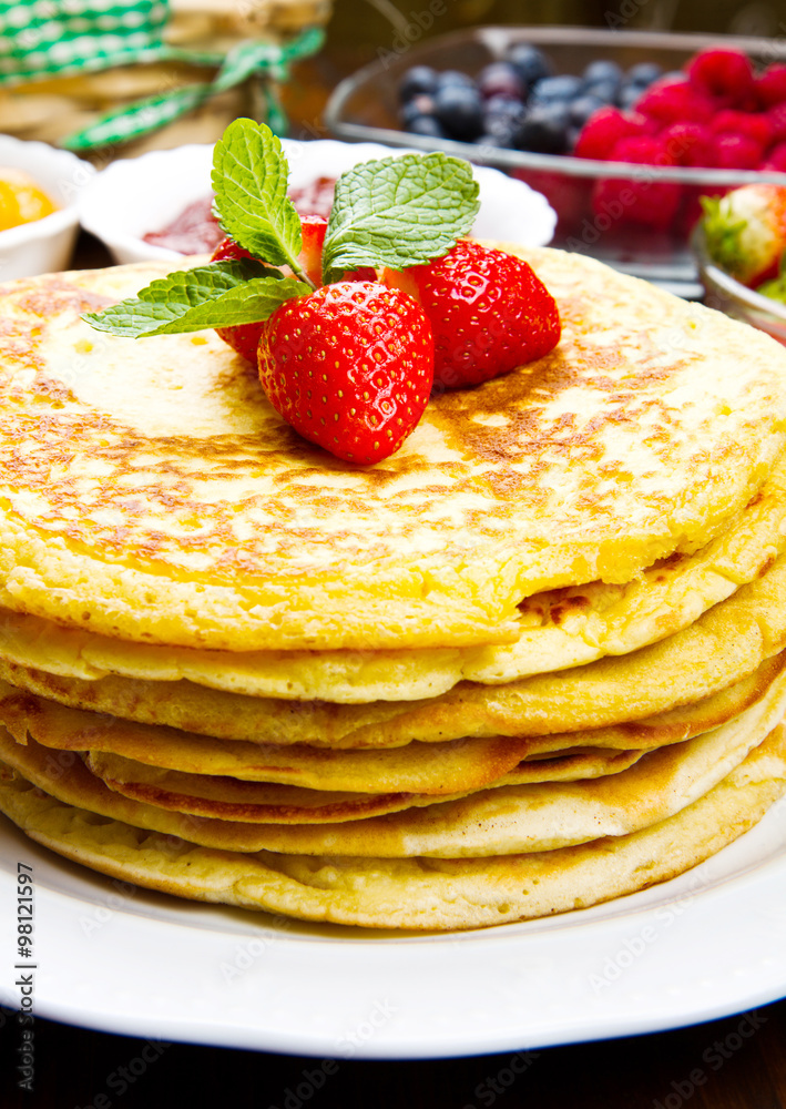 stack of freshly prepared traditional pancakes with strawberries stack of freshly prepared traditional pancakes with strawberries