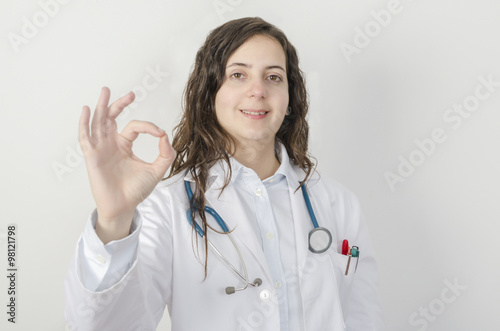 Young woman making doctor  the OK gesture.