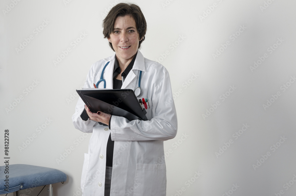 Female doctor is examining and writing a diagnosis Female doctor is examining and writing a diagnosis
