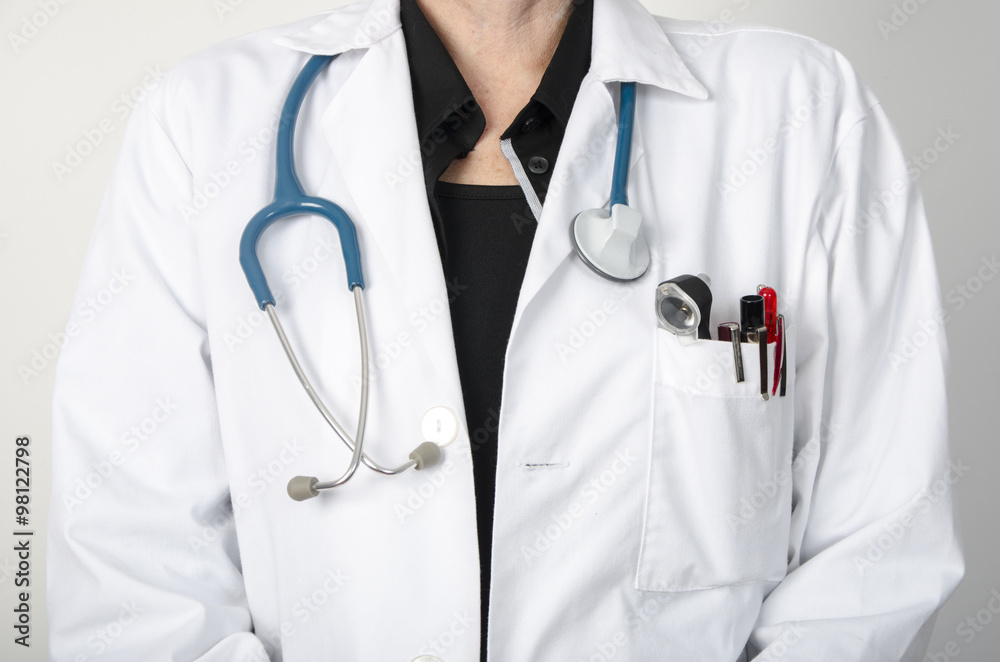 Female doctor with a stethoscope at neck, not face visible Female doctor with a stethoscope at neck, not face visible