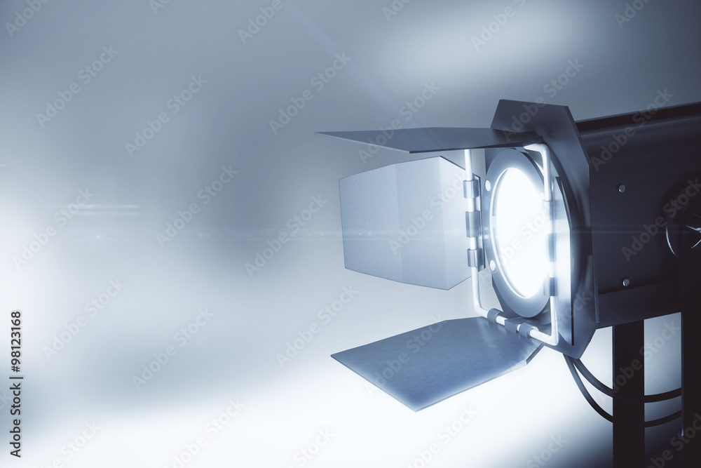 Obraz premium Old style movie camera at grey background