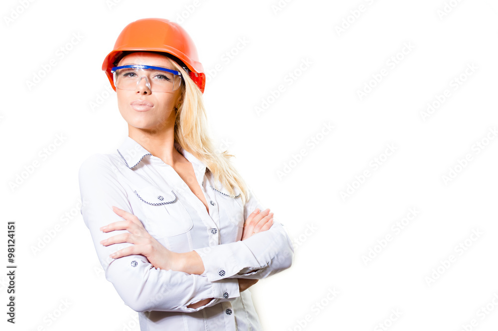 Young Attractive Female Wearing Hard Hat and Safety Glasses Young Attractive Female Wearing Hard Hat and Safety Glasses