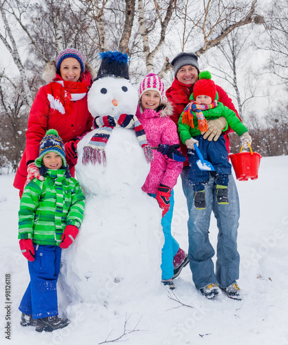 Family with a snowman photo