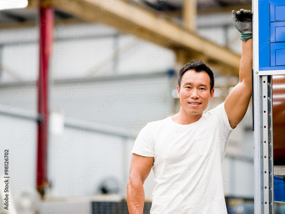 Asian worker in production plant on the factory floor Asian worker in production plant on the factory floor