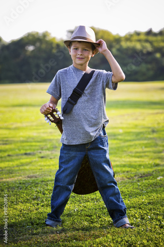 portrait of a little boy with guitar