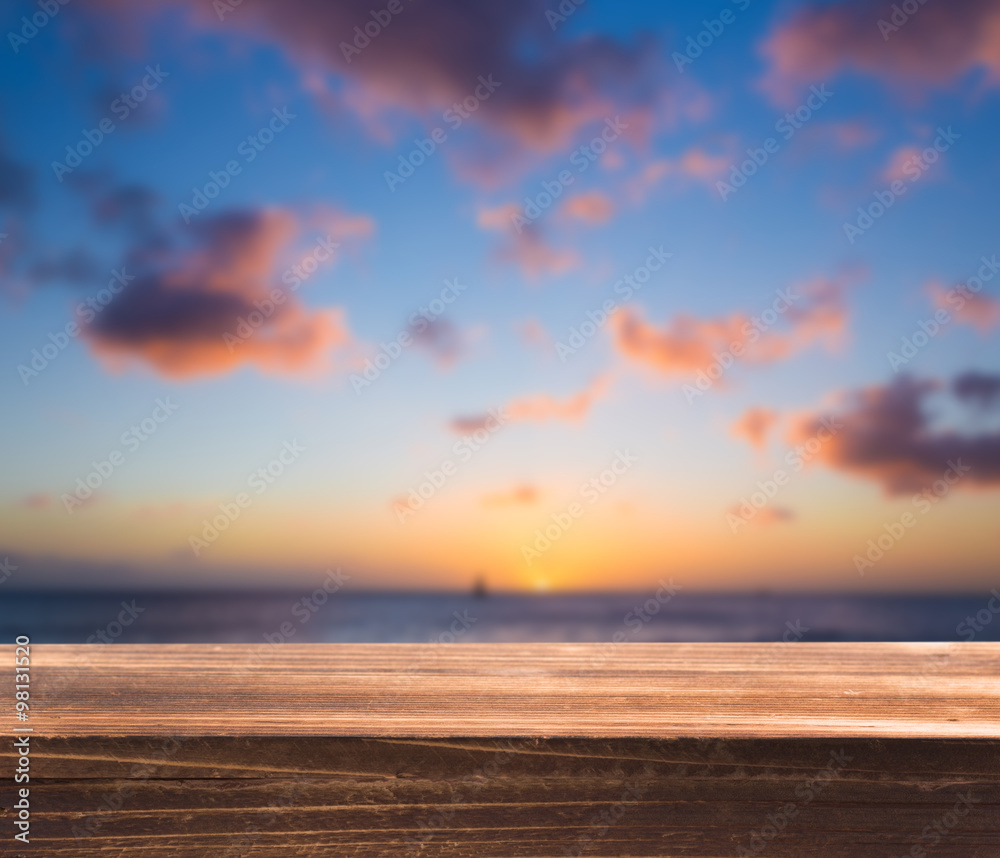 Fototapeta premium Wood table top with blur sea background