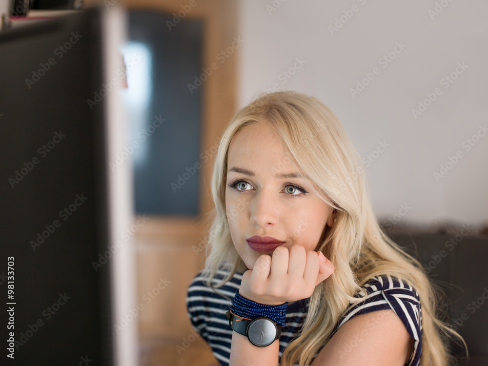 beautiful young woman working on her computer in her office beautiful young woman working on her computer in her office