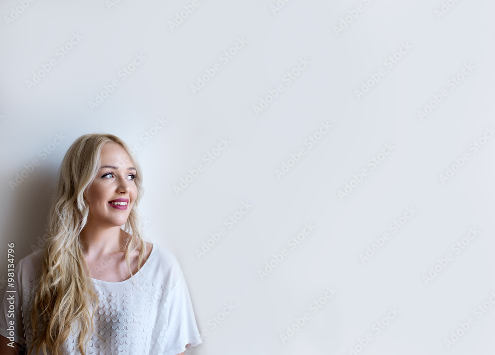 Thinking about - portrait of beautiful pondering blonde girl wit Thinking about - portrait of beautiful pondering blonde girl wit