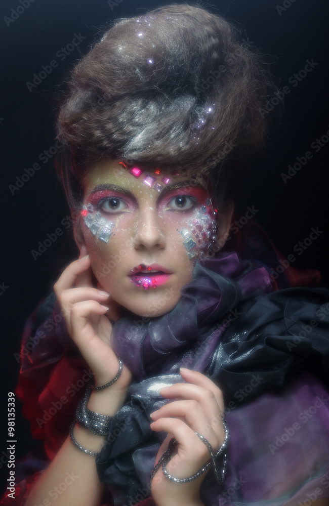 Fashion portrait of a beautiful model with creative make up