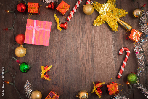 Christmas gift box, food decor and fir tree branch on wooden table. Top view with copy space