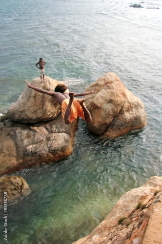 An incredible jump from a cliff into the ocean