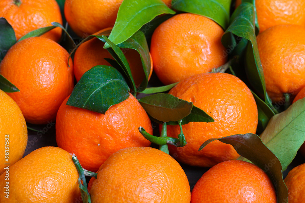 background Bunch of fresh tangerines oranges on market background Bunch of fresh tangerines oranges on market