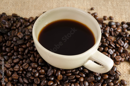 Americoano coffee cup and coffee beans