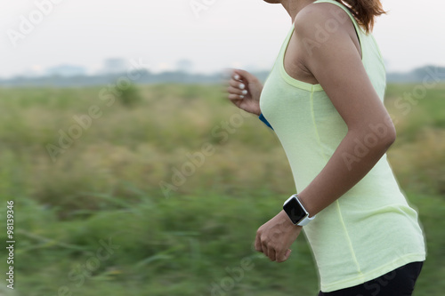 women wear smart hand watch running motion blur conceptt photo